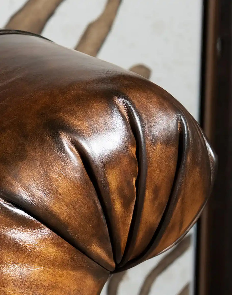 Close-up of the mocha leather texture on the Sleepers Haven Mocha Recliner, showcasing its premium material quality.