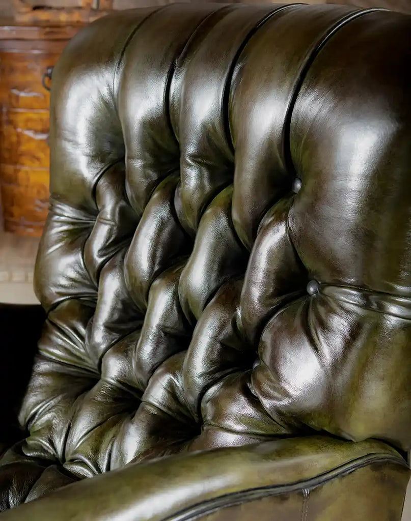 A detailed shot of the deep button tufting on the backrest, enhancing the recliner’s luxurious and classic appeal.