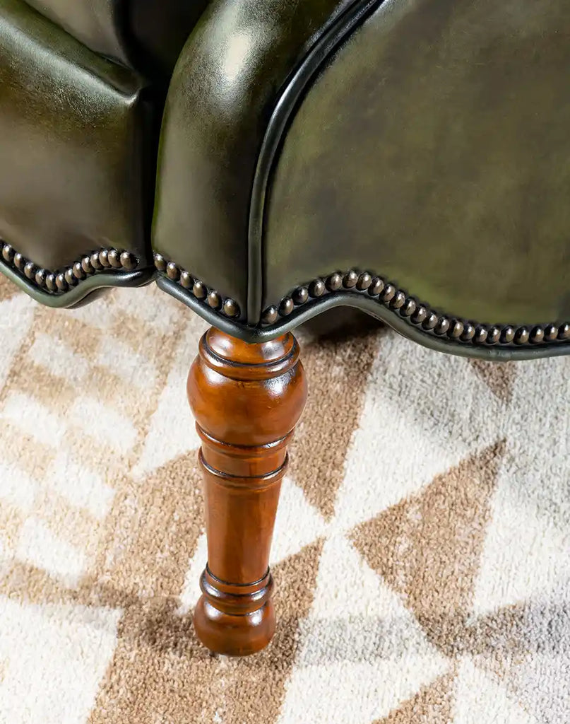 A close-up of the sturdy wooden leg, providing reliable support and a refined finishing touch to the design.