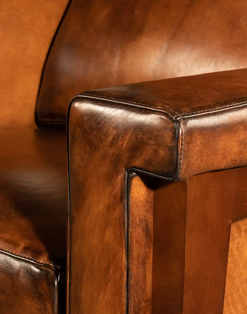 A detailed close-up of the mocha leather texture on the Snyder Leather Recliner, showcasing its luxurious full-grain finish.