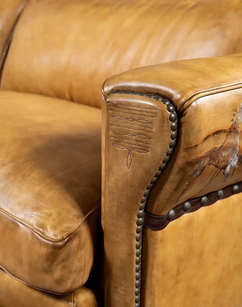 Detailed view of the Stallion Leather Sofa armrest, showcasing its unique channel-stitched and leather-welted design.