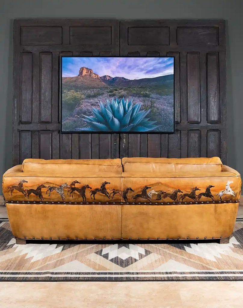 Back view of the Stallion Leather Sofa showcasing the intricate hand-painted horse artwork by Wayne Parmenter.