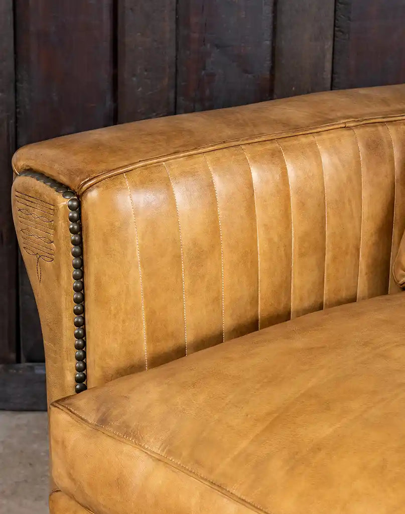 Close-up of the channel-stitched design on the interior arms of the Stallion Leather Sofa for added elegance.