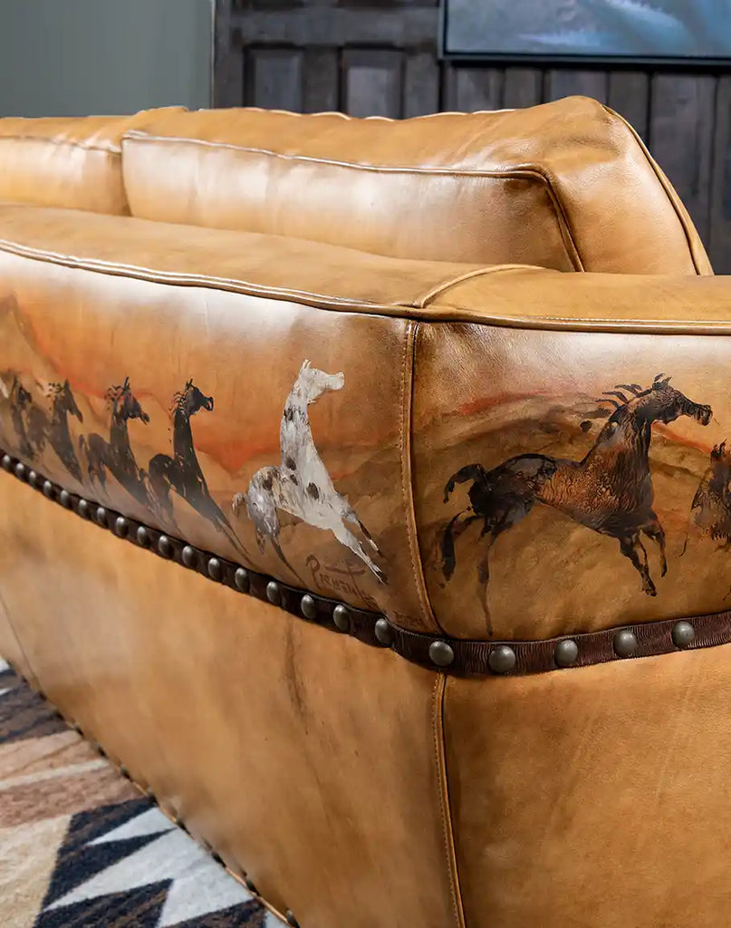 Close-up of the hand-burnished leather texture on the Stallion Leather Sofa, showcasing its vintage-inspired finish.