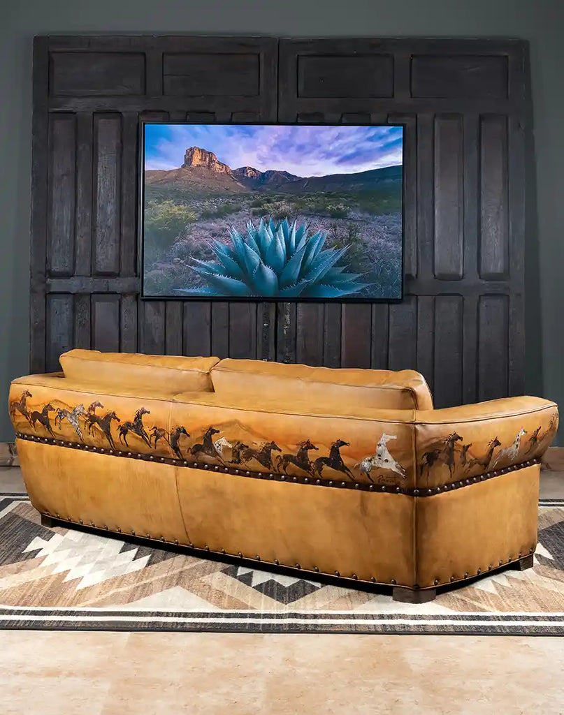 The Stallion Leather Sofa styled in a Southwestern-inspired living room, showcasing its blend of artistry and comfort.