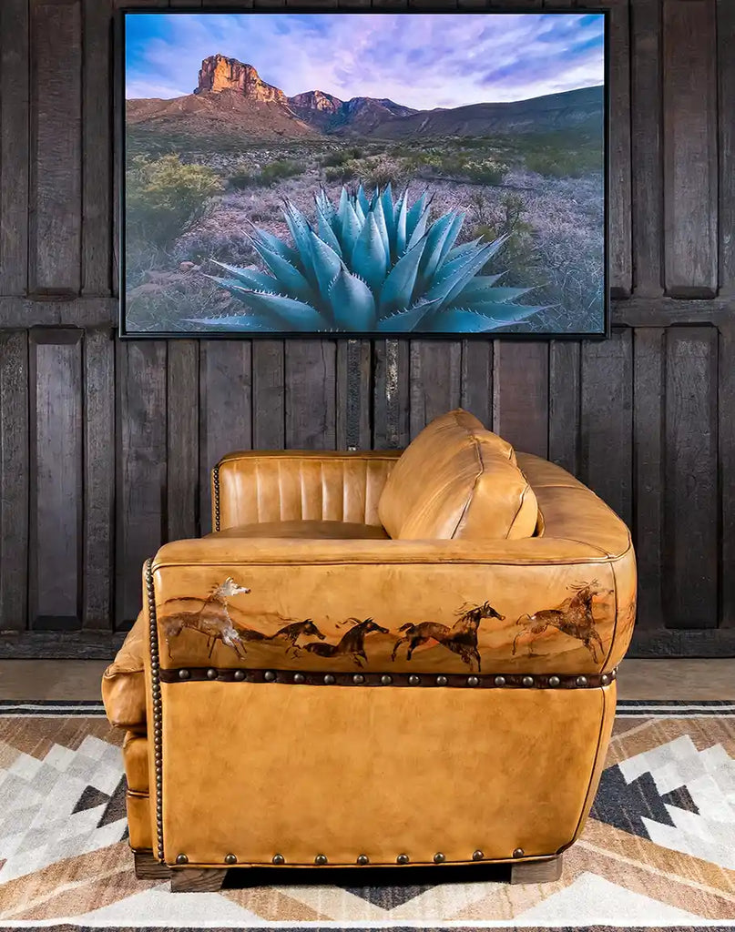 Side view of the Stallion Leather Sofa featuring detailed leather craftsmanship and hand-painted artwork.