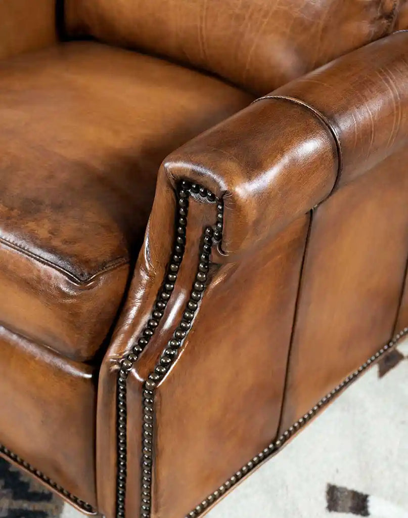 A detailed view of the carefully applied brass nail tacks on the Stanford Recliner, adding a timeless touch of sophistication.