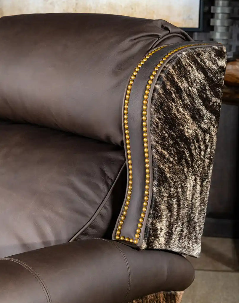 A close-up of the grandly scaled bustle-back design on the Stanley Brindleback Recliner, offering superior head and back support.