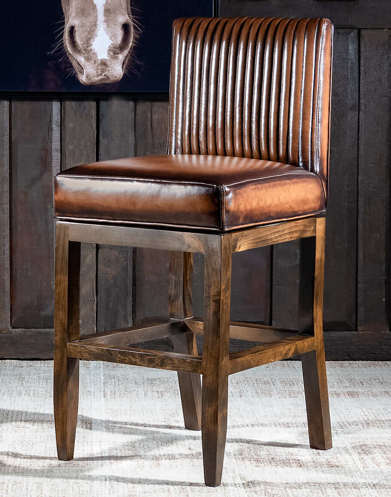 Stanley Mocha Leather Barstool showcasing its rich leather upholstery, sturdy wooden legs, and timeless design.