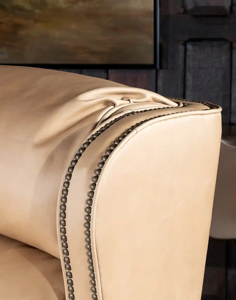 Close-up of the light sand top-grain leather on the Stanley Sandstone Recliner, showcasing its smooth texture and premium quality.