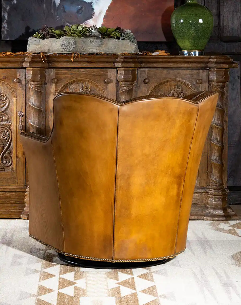 A rear view of the chair, displaying the smooth hand-burnished leather and refined craftsmanship.