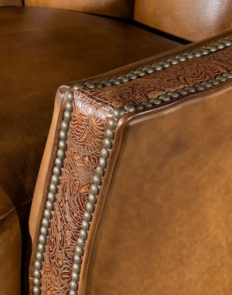 A detailed shot of the embossed leather arm panel, adding a bold contrast to the chair’s design.