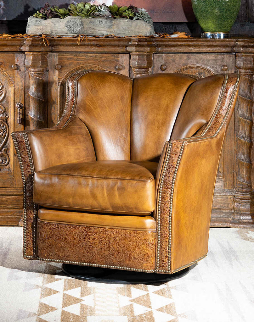 Steven Swivel Glider highlighting its rich tan leather upholstery and classic western design.