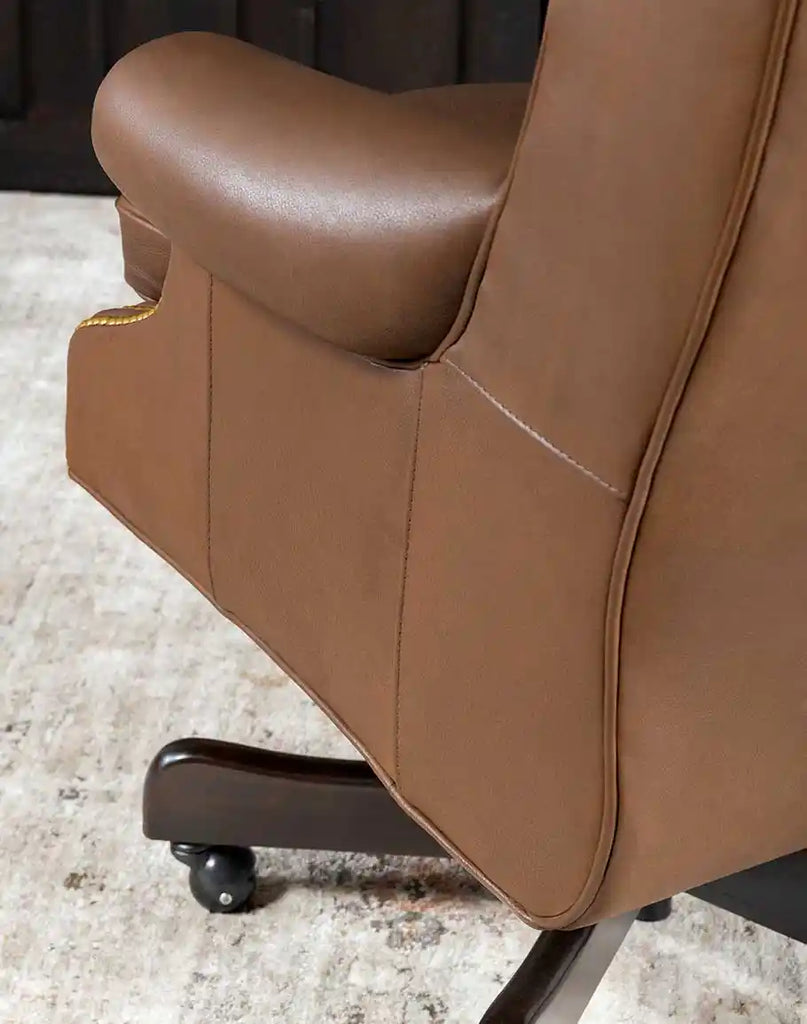 View of the adjustable mechanism under the Stockman Executive Desk Chair, allowing for personalized comfort and height adjustment.