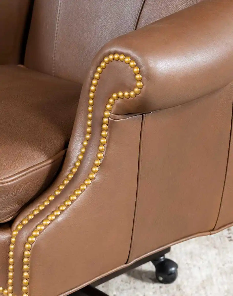 Detailed view of the rolled armrests on the Stockman Executive Desk Chair, showcasing the plush leather and expert craftsmanship.