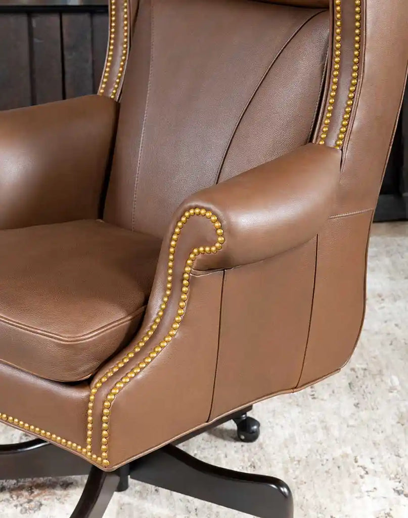 Close-up of the Stockman Executive Desk Chair's sturdy base with smooth-rolling casters for easy mobility.