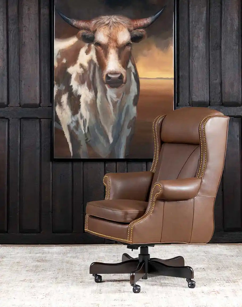 The Stockman Executive Desk Chair placed in a sophisticated home office.