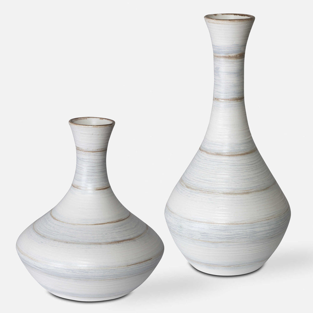 Set of two handcrafted ceramic Potter vases with fluted design and striped ivory, blue, and tan glaze.