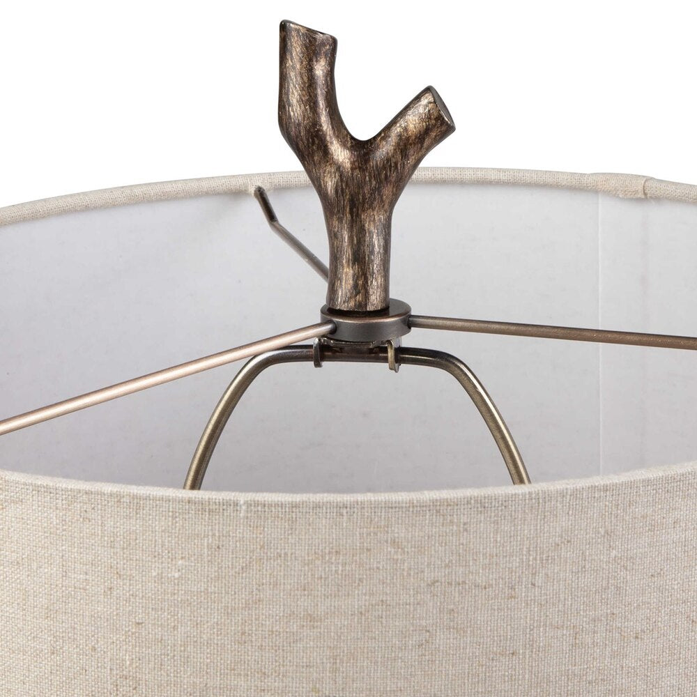 Surculus Table Lamp, showcasing its elegant tree-branch design and subtle gold details.