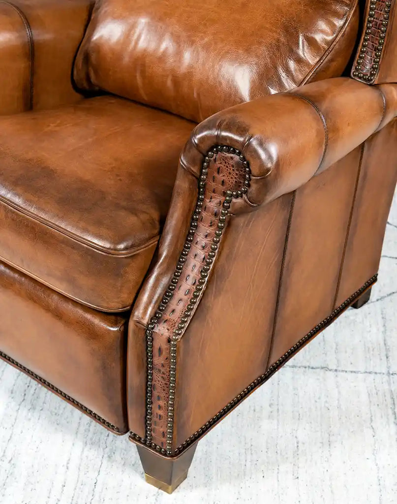 Close-up of the seat of the Tan Bronco Leather Recliner, showcasing the quality leather and plush cushioning.