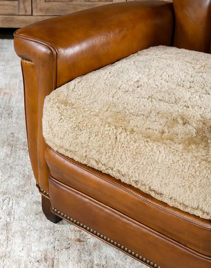 Detailed shot focusing on the upholstery-grade cream shearling hide seat cushion.