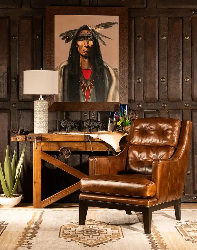 The Tan Saddleback Leather Chair styled in a living room, paired with complementary décor, adding a touch of elegance and warmth to the space.