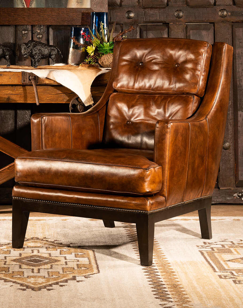 Tan Saddleback Leather Chair, showcasing its hand-burnished tan leather and sleek silhouette, designed for supreme comfort and style.