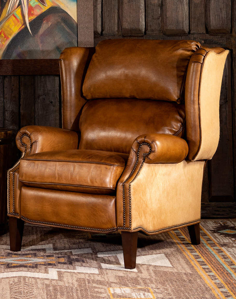 Texas Sadler Leather Recliner showcasing its high-quality tan artisan leather and elegant brass nail tacks.