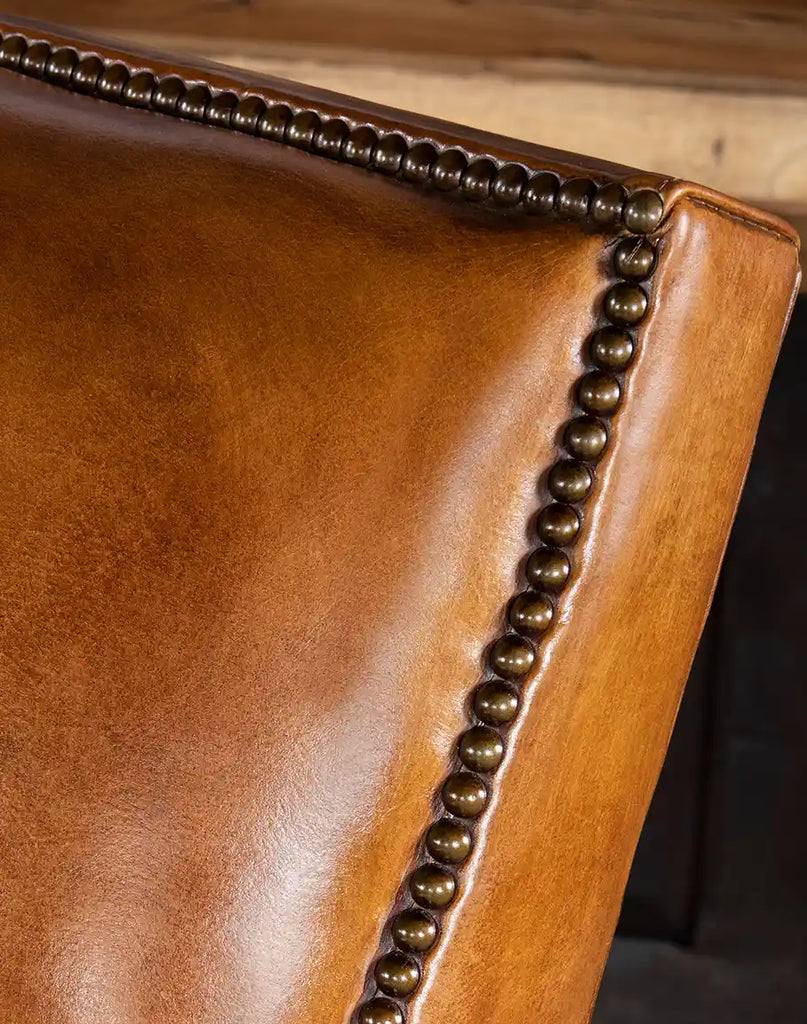 Close-up of the Pioneer Club Chair backrest, showcasing the elegant leather upholstery and tight seat back construction for added comfort.