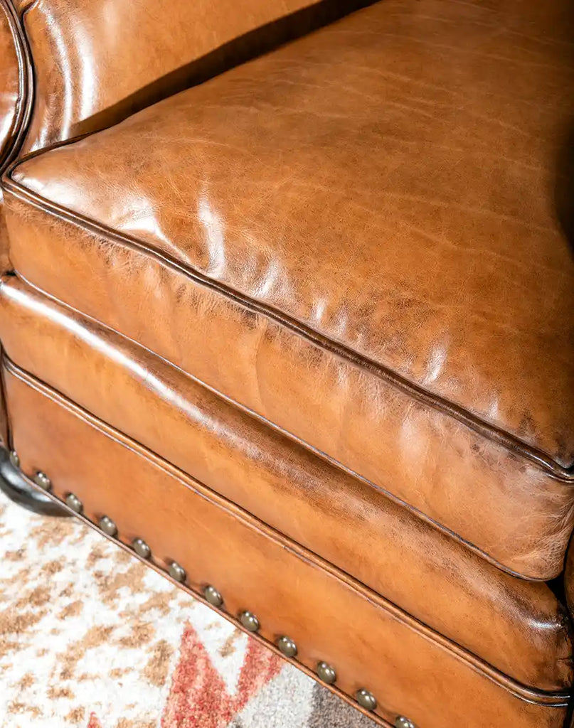 A top-down view of the King Arthur Tufted Chair emphasizing its spacious seat and premium leather upholstery.