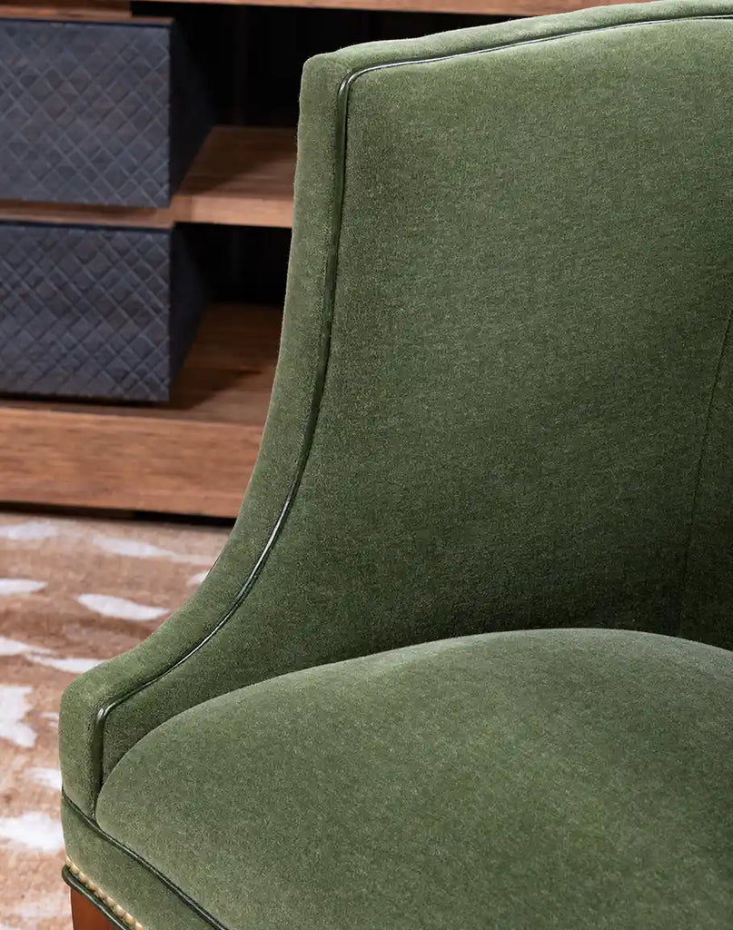 Close-up of the TX Moss Green Chair’s luxurious sage green mohair fabric texture.