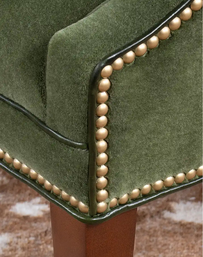 Detailed view of the TX Moss Green Chair’s full-grain leather welt in rich forest green.