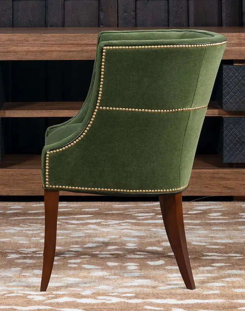 Side profile of the TX Moss Green Chair highlighting its leather trim and refined contours.