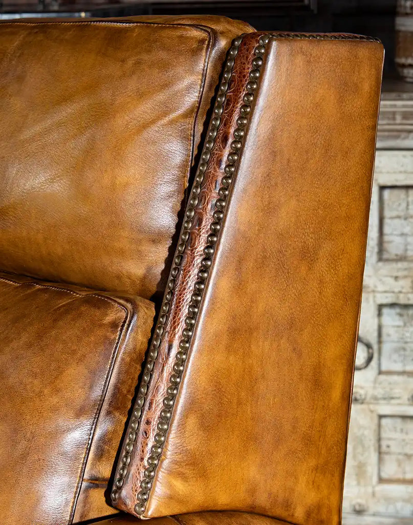 Close-up of the embossed croc leather armrests, adding a bold and sophisticated accent.