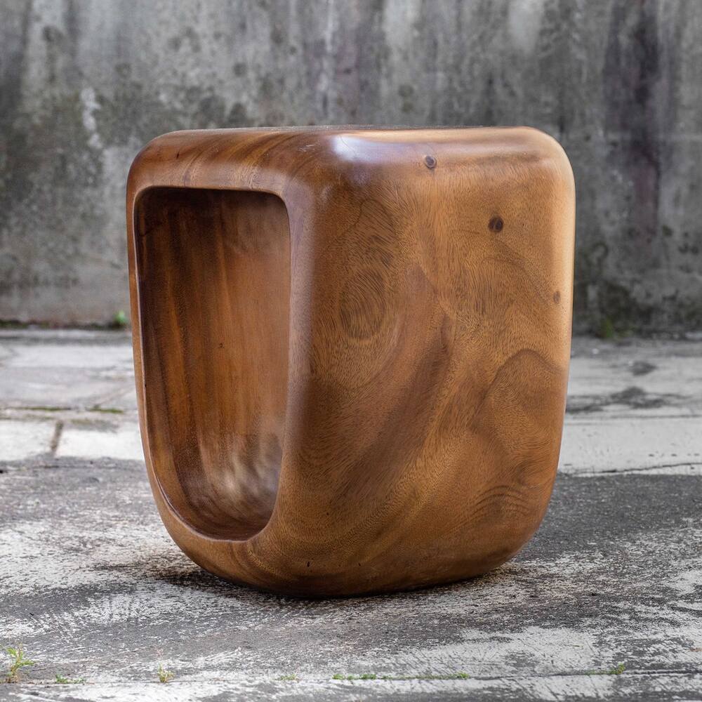 Compact stool crafted from rustic suar wood.