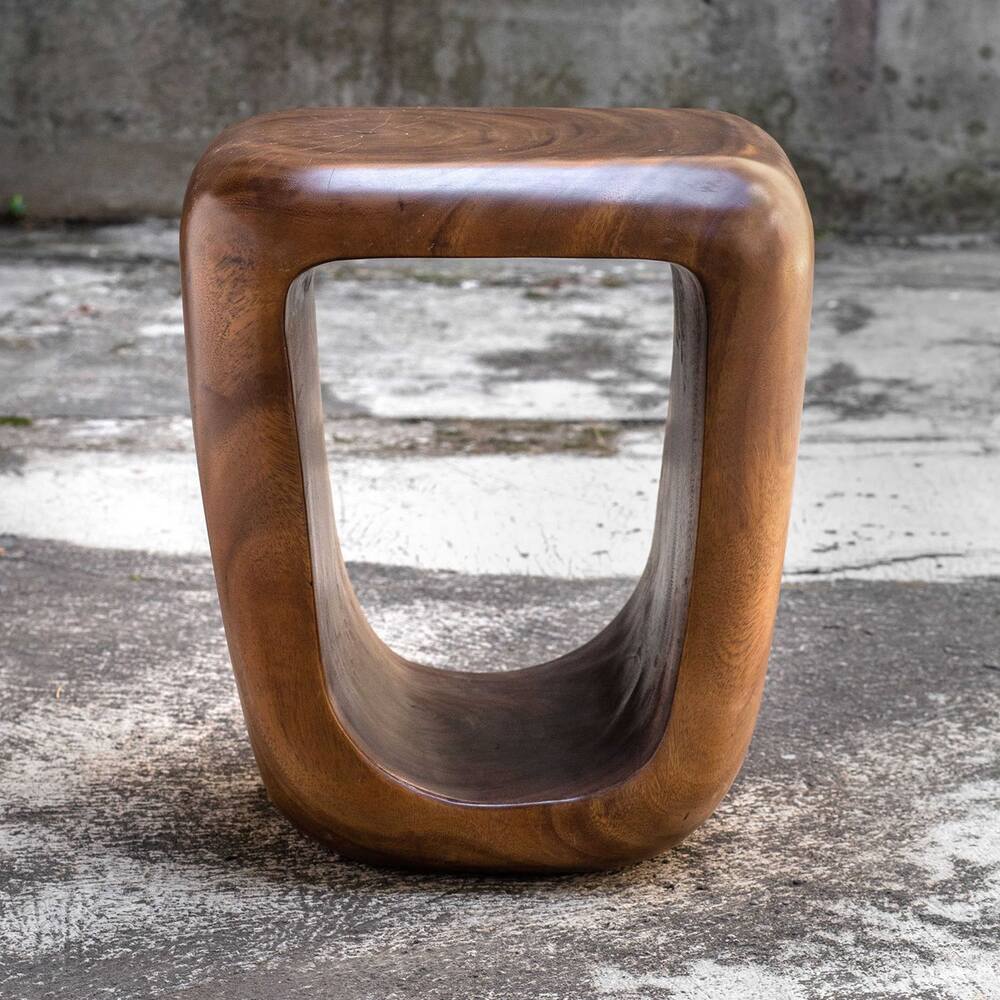 Multifunctional suar wood stool used as a table.