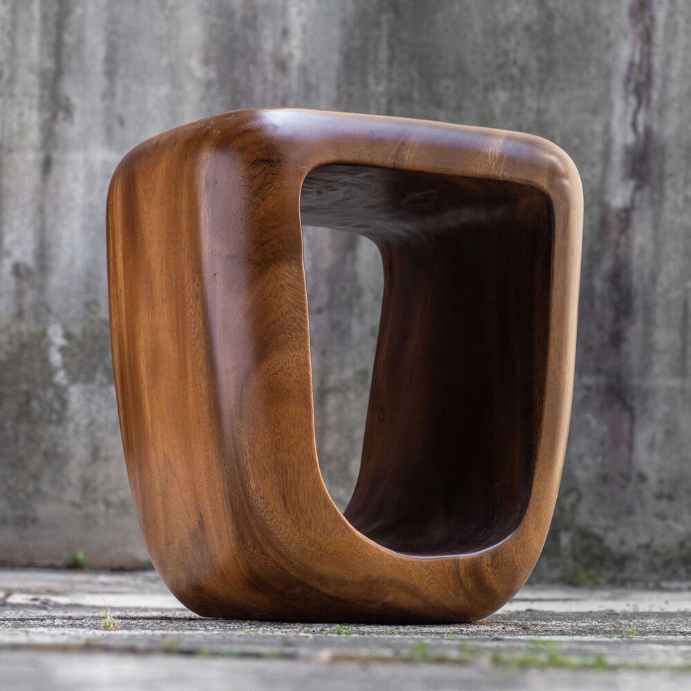 Natural textures on a suar wood stool in bright light.