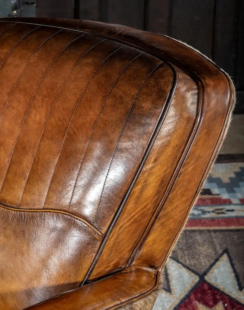 Close-up of parallel stitching detail on the seat cushion and headrest of the Vaquero Swivel Chair.