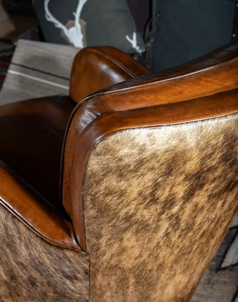 Detailed view of the brindle cowhide adorning the outside back of the Vaquero Swivel Chair.