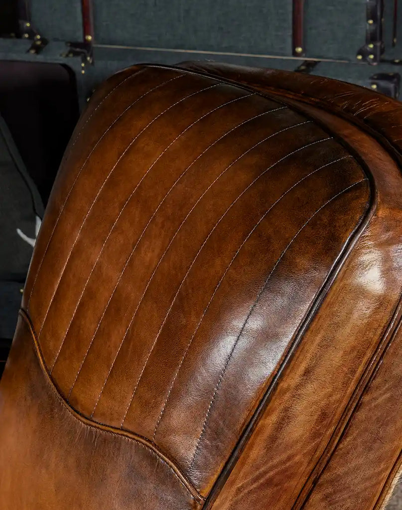 Detailed view of the plush seat cushion with hand-burnished leather on the Vaquero Swivel Chair.