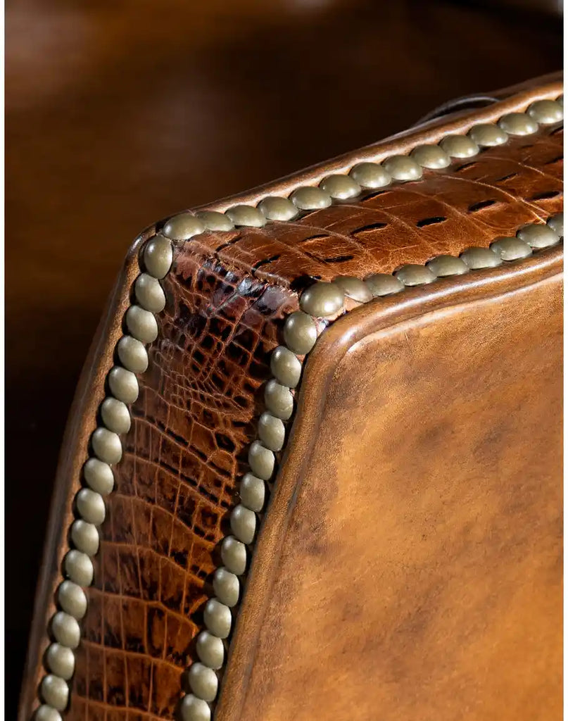 A close-up view of the nail head trim, enhancing the chair’s refined Western aesthetic.