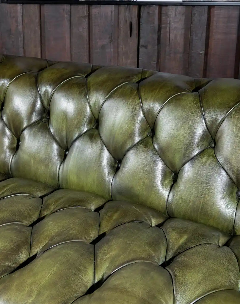 This view highlighting the rich texture and depth of the olive green full-grain leather.