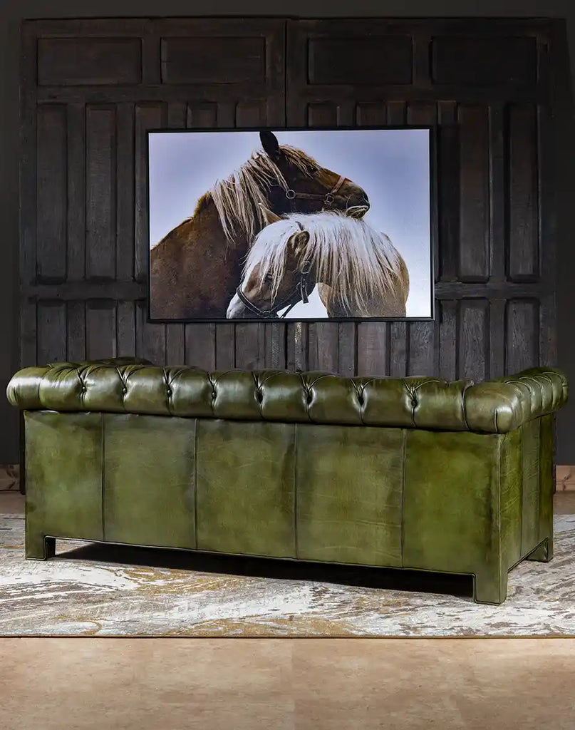 Back view of the sofa with visible hand-burnished details.