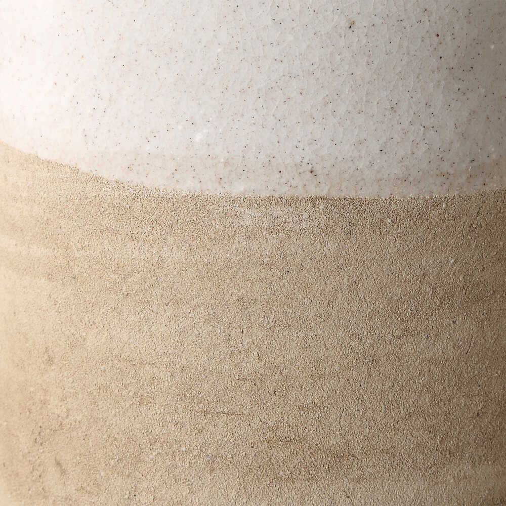 Close-up of Vivory White Ceramic vase showcasing a coastal-inspired sandy base and crackled white design.