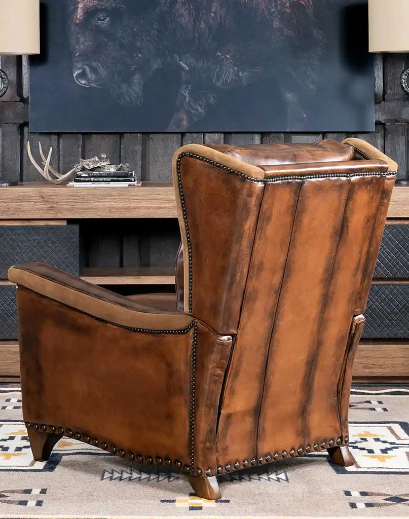 Vlad Brown Leather Recliner placed in a rustic living room setting, paired with wooden furniture and decor.