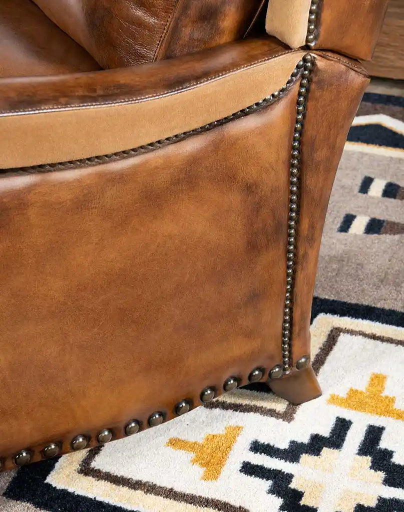 Nailhead trim detail on the Vlad Brown Leather Recliner, adding a touch of elegance to its rugged design.