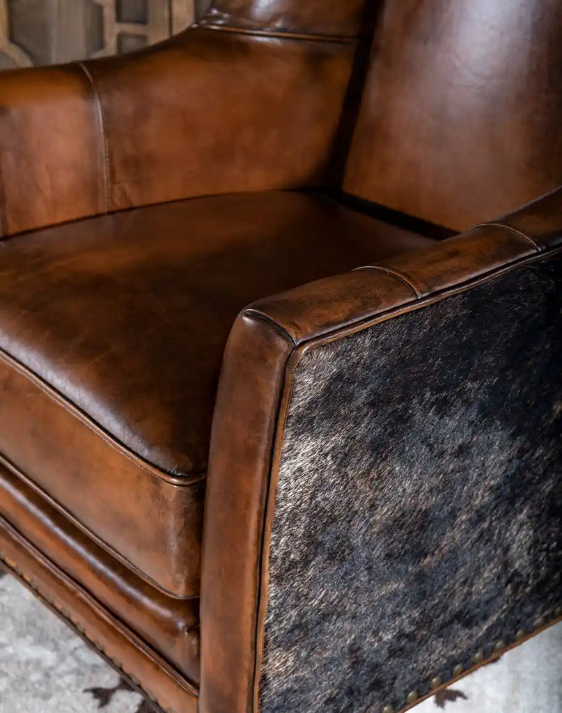 A close-up view of the Westlife Leather Chair’s full-grain leather upholstery and hand-burnished accents.