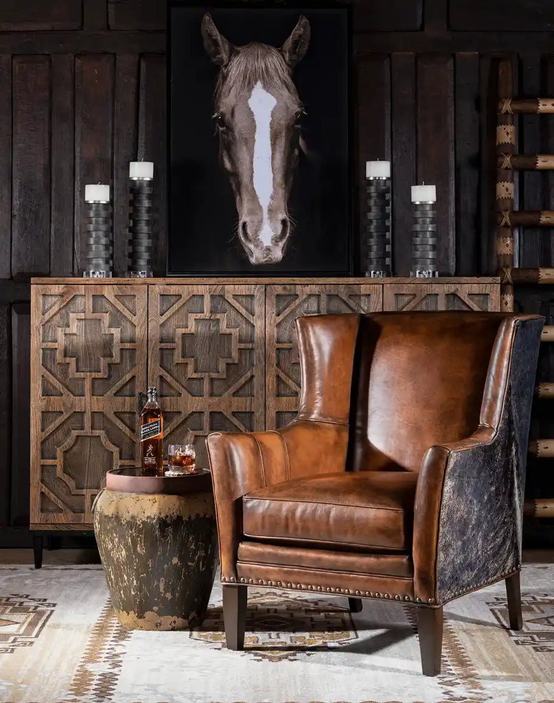 The Westlife Leather Chair styled in a cozy living room, blending luxury and tradition seamlessly.