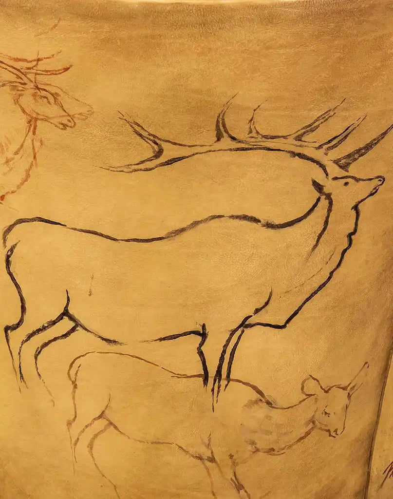 A close-up of the hand-painted elk petroglyph artwork on the Wild Elk Leather Chair, designed by artist Wayne Parmenter.