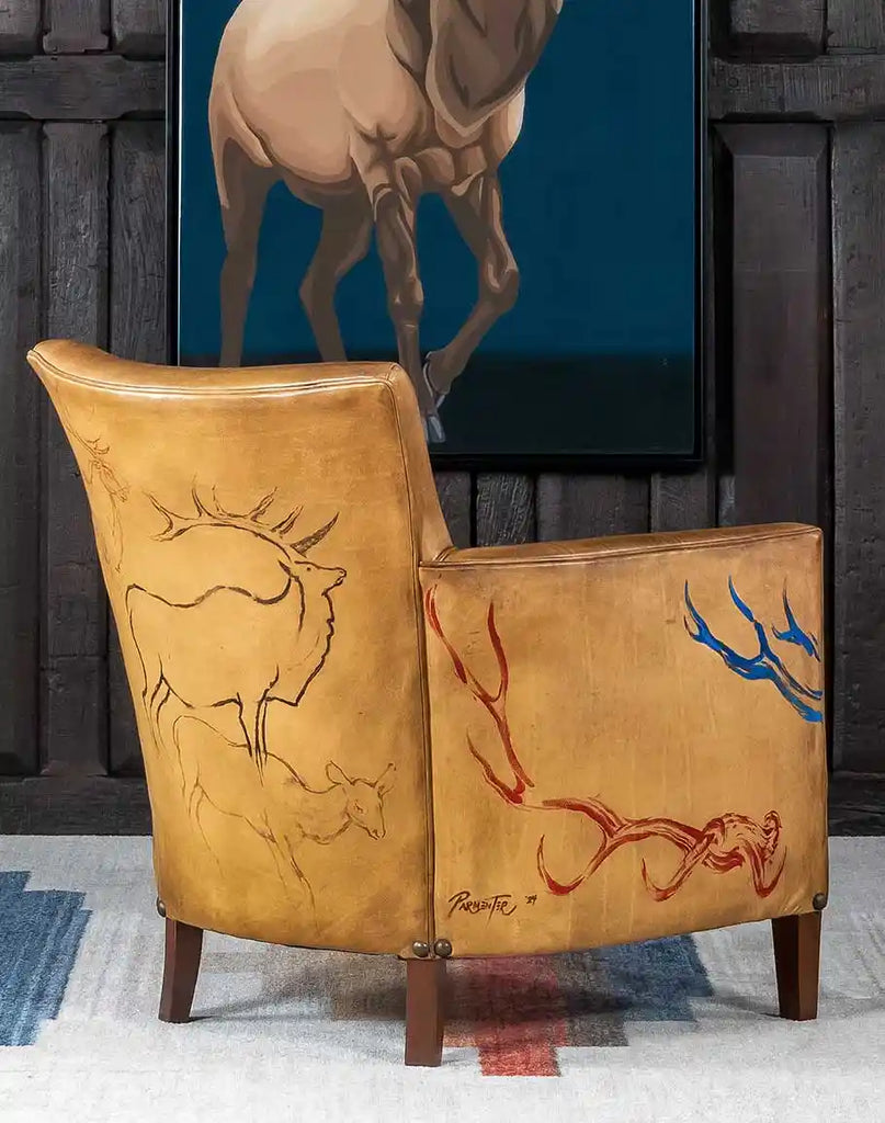 The sturdy wooden legs of the Wild Elk Leather Chair, showcasing a rustic finish that complements the leather upholstery.